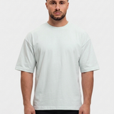 Oversized Cotton T-Shirt Mint — voorkant, Calvin (1,83 m) draagt maat S